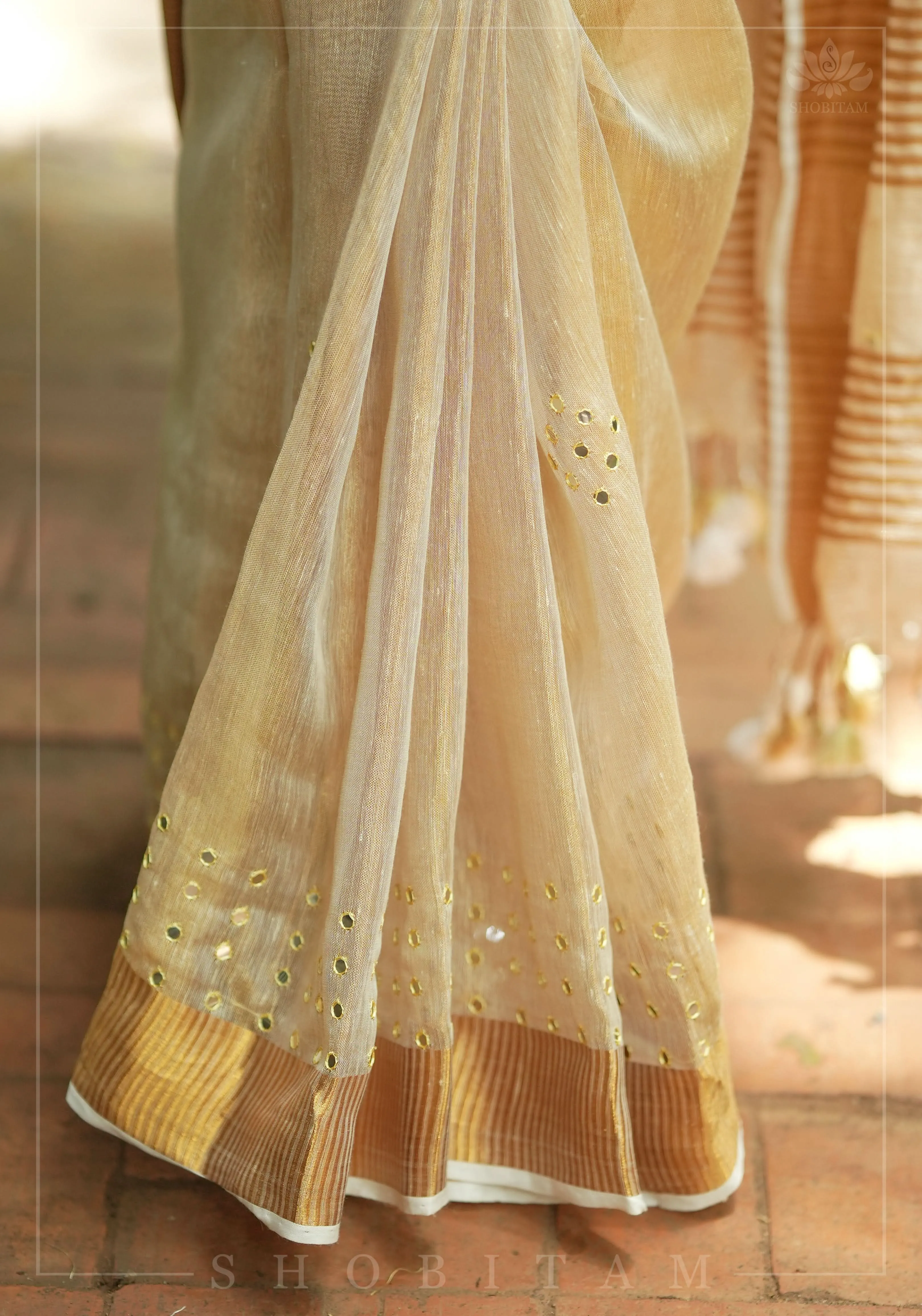 Tan Gold Tissue Linen Saree with light mirror work