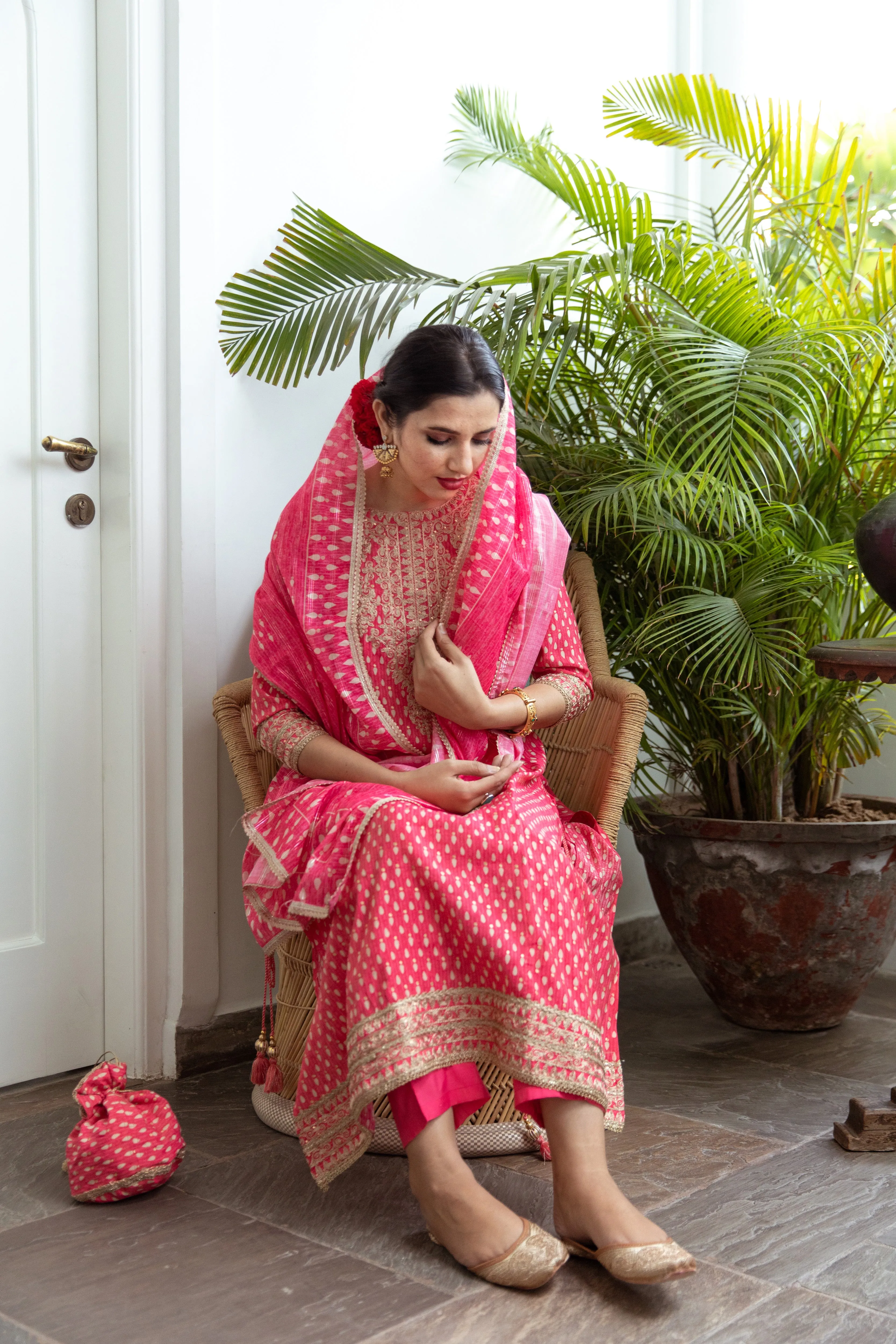 Women Pink Muslin A-line Kurta Trouser Dupatta & Fancy Potli Set